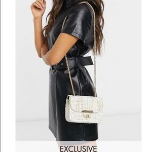 Crossbody bag with gold chain strap